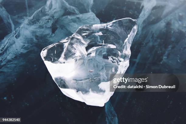 transparent ice block on lake baikal - crystals stock-fotos und bilder