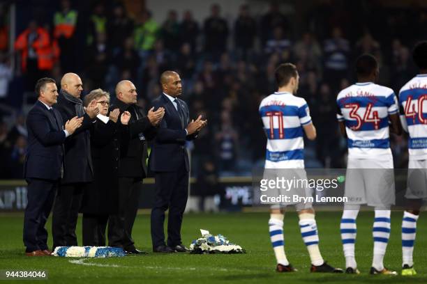 Members of the family of Ray Wilkins lay a wreath on the pitch prior to the Sky Bet Championship match between Queens Park Rangers and Sheffield...