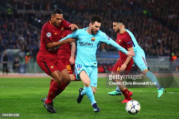 Juan Jesus of AS Roma in action with Lionel Messi of FC Barcelona during the UEFA Champions League Quarter Final, second leg match between AS Roma...