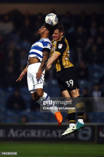 Darnell Furlong of Queen's Park Rangers clashes with Jordan Thorniley of Sheffield Wednesday during the Sky Bet Championship match between Queens...