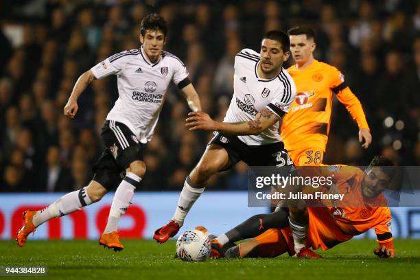 Aleksandar Mitrovic of Fulham is challenged by Tiago Ilori of Reading during the Sky Bet Championship match between Fulham and Reading at Craven...