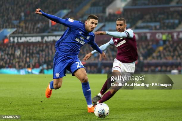 Cardiff City's Marko Grujic and Aston Villa's Lewis Grabban battle for the ball during the Sky Bet Championship match at Villa Park, Birmingham.