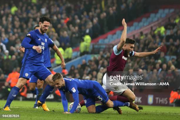 Robert Snodgrass of Aston Villa is deemed to have not been fouled by Joe Bennett of Cardiff City as Aston Villas shouts for a penalty go unanswered...