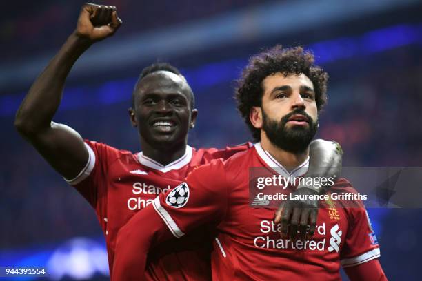 Mohamed Salah of Liverpool celebrates with teammate Sadio Mane after scoring his sides first goal during the UEFA Champions League Quarter Final...