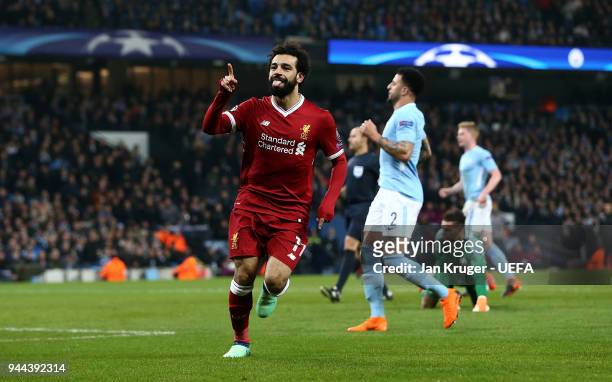 Mohamed Salah of Liverpool celebrates scoring his sides first goal during the UEFA Champions League quarter final second leg match between Manchester...