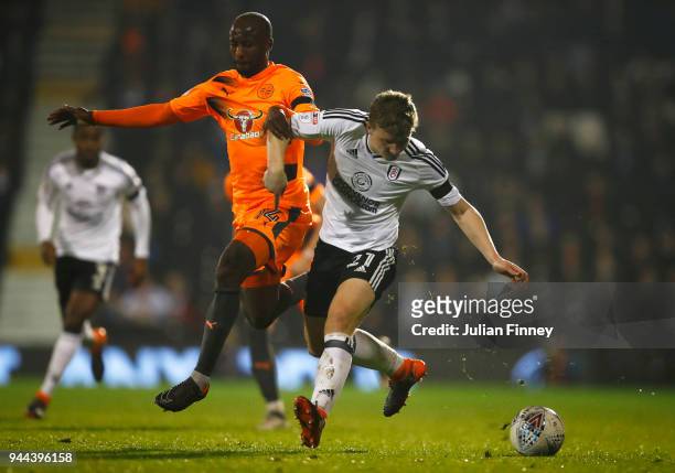Sone Aluko of Reading battles for posession with Matt Targett of Fulham during the Sky Bet Championship match between Fulham and Reading at Craven...