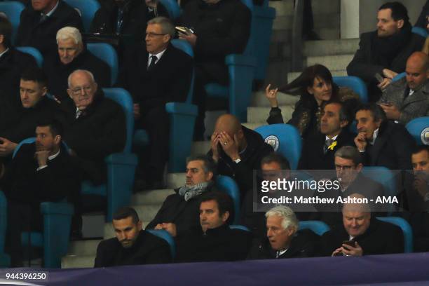 Pep Guardiola the head coach / manager of Manchester City reacts after the second goal whilst sat in the stands after being sent off at half time...