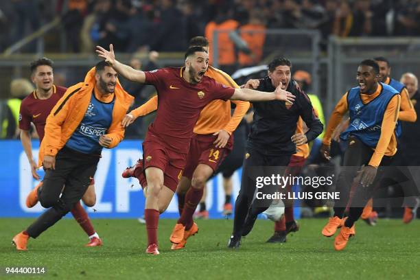 Roma's Greek defender Kostas Manolas celebrates after scoring a goal during the UEFA Champions League quarter-final second leg football match between...