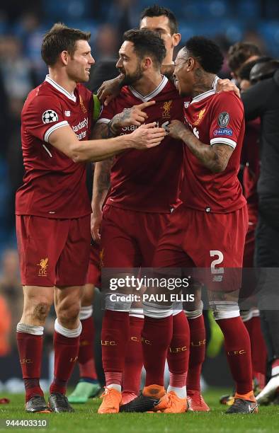 Liverpool's English striker Danny Ings , Liverpool's English midfielder James Milner and Liverpool's English defender Nathaniel Clyne react at the...