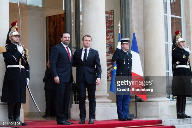 Emmanuel Macron, France's president, right, and Saad Hariri, Lebanon's prime minister, stand for photographs at the Elysee palace in Paris, France,...