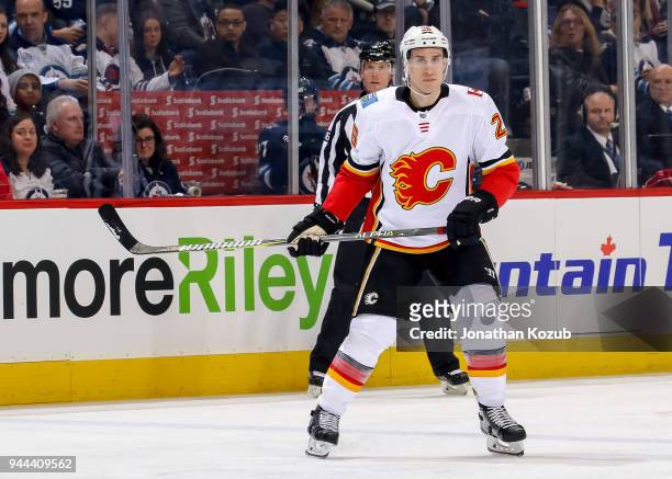 Michael Stone of the Calgary Flames keeps an eye on the play during first period action against the Winnipeg Jets at the Bell MTS Place on April 5,...