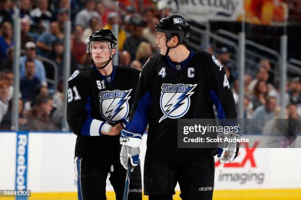 Vincent Lecavalier of the Tampa Bay Lightning talks with teammate Steven Stamkos during a break in the play against the Washington Capitals at the...