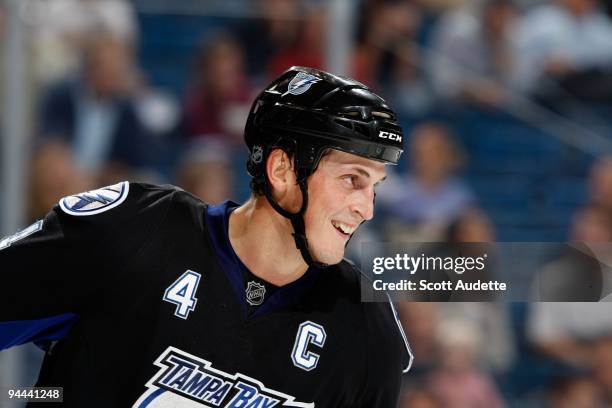 Vincent Lecavalier of the Tampa Bay Lightning smiles during a break in the play against the Edmonton Oilers at the St. Pete Times Forum on December...