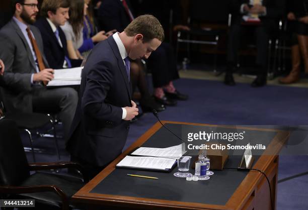 Facebook co-founder, Chairman and CEO Mark Zuckerberg departs for a brief break while testifying before a combined Senate Judiciary and Commerce...