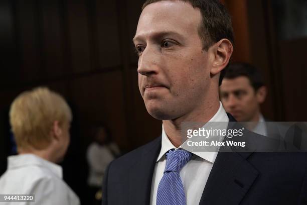 Facebook co-founder, Chairman and CEO Mark Zuckerberg returns to the witness table after taking a brief break while testifying before a combined...