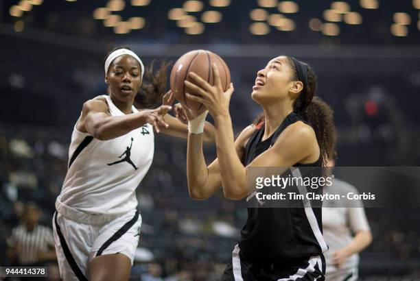 April 08: Shakira Austin Riverdale Baptist School, Upper Marlboro, MD drives to the basket defended by Charli Collier Barbers Hill H.S. Mont Belvieu,...
