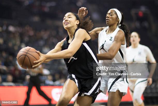 April 08: Shakira Austin Riverdale Baptist School, Upper Marlboro, MD drives to the basket defended by Charli Collier Barbers Hill H.S. Mont Belvieu,...