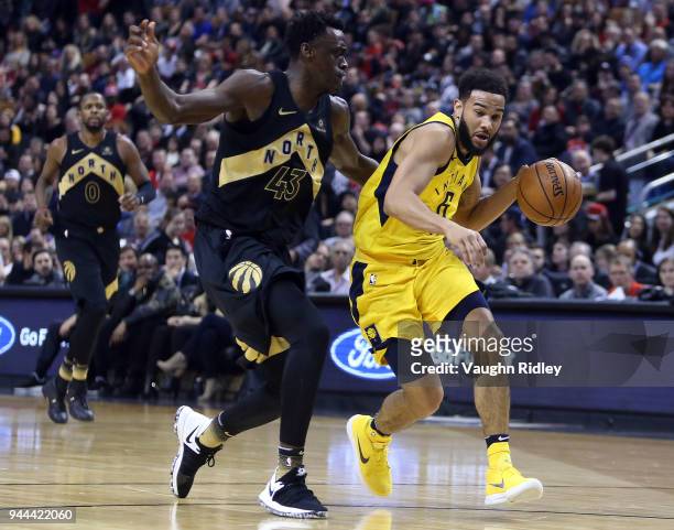 Cory Joseph of the Indiana Pacers dribbles the ball as Pascal Siakam of the Toronto Raptors defends during the first half of an NBA game at Air...