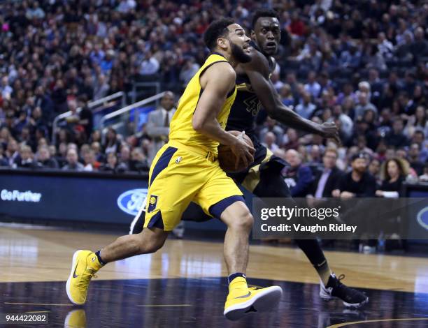 Cory Joseph of the Indiana Pacers dribbles the ball as Pascal Siakam of the Toronto Raptors defends during the first half of an NBA game at Air...