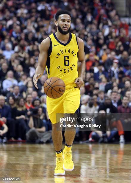 Cory Joseph of the Indiana Pacers dribbles the ball during the first half of an NBA game against the Toronto Raptors at Air Canada Centre on April 6,...