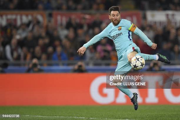 Barcelona's Argentinian forward Lionel Messi kicks the ball during the UEFA Champions League quarter-final second leg football match between AS Roma...