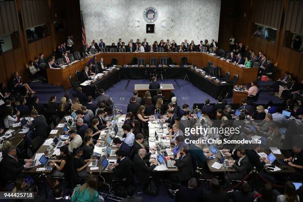 Reporters sit shoulder-to-shoulder behind Facebook co-founder, Chairman and CEO Mark Zuckerberg as he testifies before a combined Senate Judiciary...