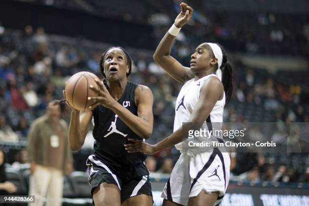April 08: Queen Egbo Travis H.S. Richmond, TX drives to the basket defended by Elizabeth Balogun Hamilton Heights H.S. Chattanooga, TN during the...