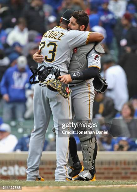 Felipe Rivero of the Pittsburgh Pirates hugs Francisco Cervelli after a win against the Chicago Cubs during the Opening Day home game at Wrigley...