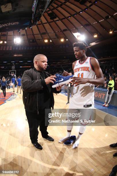 Frank Ntilikina of the New York Knicks signs autographs for fans after the game against the Cleveland Cavaliers on April 9, 2018 at Madison Square...