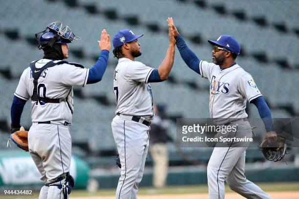 Tampa Bay Rays catcher Wilson Ramos , Tampa Bay Rays relief pitcher Alex Colome and Tampa Bay Rays' Denard Span high five after beating the Chicago...