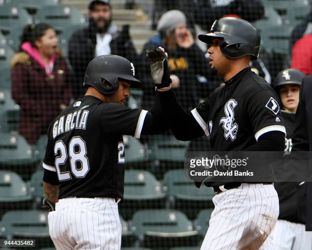 Jose Abreu of the Chicago White Sox is greeted by Leury Garcia after hitting a three-run homer against the Tampa Bay Rays during the ninth inning on...