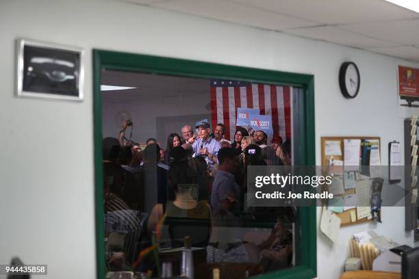 Florida Governor Rick Scott addresses supporters as he holds a Senate campaign rally at the Interstate Beverage Corp. On April 10, 2018 in Hialeah,...