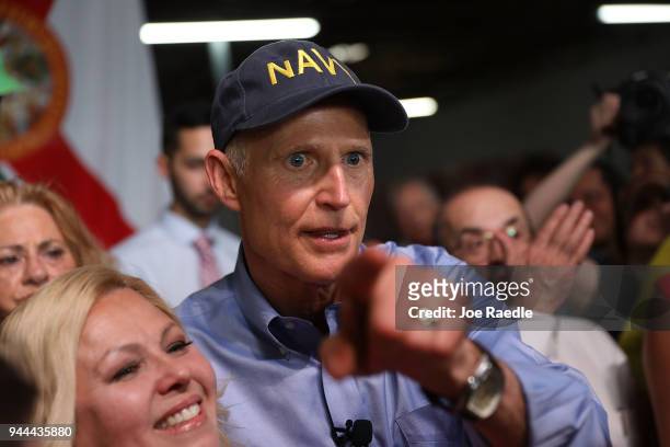 Florida Governor Rick Scott greets people as he holds a Senate campaign rally at the Interstate Beverage Corp. On April 10, 2018 in Hialeah, Florida....