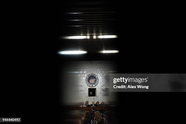 Senators listen as Facebook co-founder, Chairman and CEO Mark Zuckerberg testifies before a combined Senate Judiciary and Commerce committee hearing...