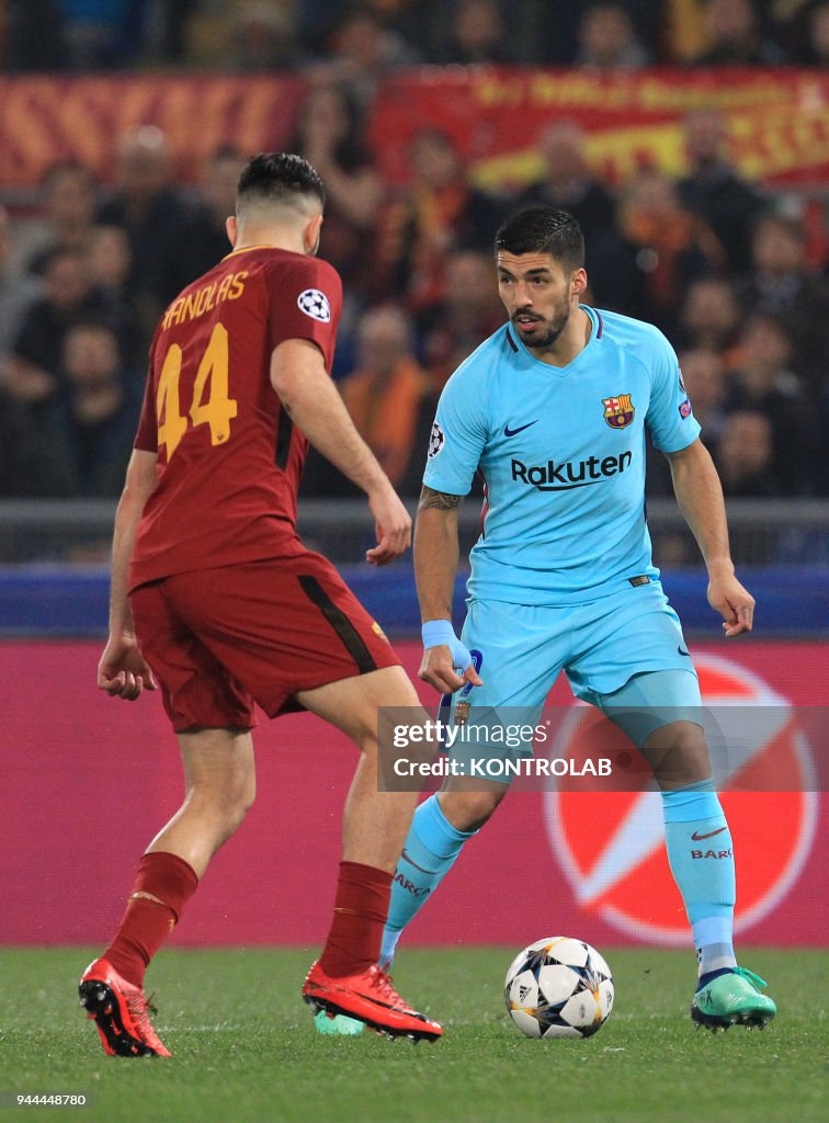 Barcelona's Uruguayan striker Luis Suarez (R) controls the...