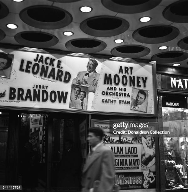 The Paramount Theatre entrance reads "Jack E. Leonard 'World's Largest Comedian' Jerry Brandow, Ar Mooney and Orchestra featuring Cathy Ryan in...