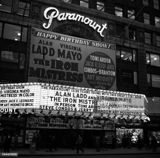 The Paramount Theatre marquee reads "The Paramount is 26 years young with this great 2 for 1 show; Alan Ladd and Virgnia Mayo 'The Iron Mistress'...