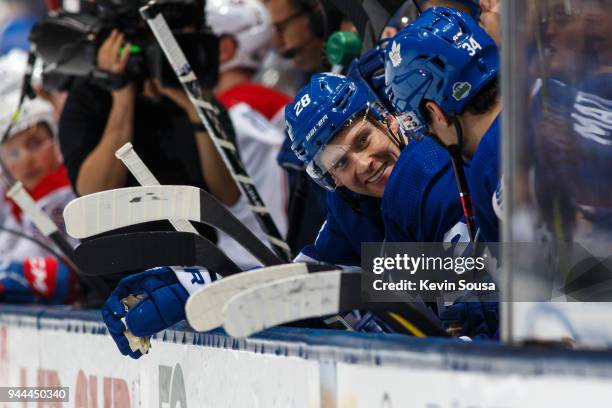 Connor Brown of the Toronto Maple Leafs talks to Auston Matthews on the bench against the Montreal Canadiens during the third period at the Air...