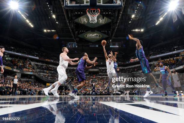 Cory Joseph of the Indiana Pacers shoots the ball during the game against the Charlotte Hornets on April 10, 2018 at Bankers Life Fieldhouse in...