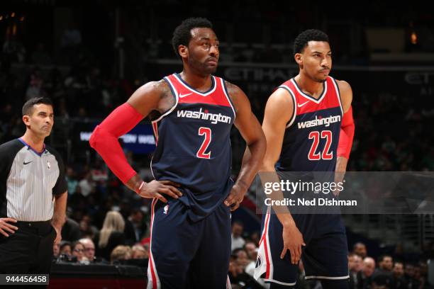 John Wall and Otto Porter Jr. #22 of the Washington Wizards look on during the game against the Boston Celtics on April 10, 2018 at Capital One Arena...