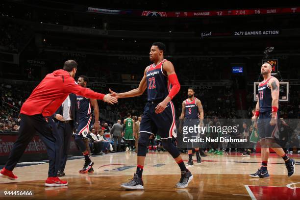 Otto Porter Jr. #22 of the Washington Wizards high fives his teammates during the game against the Boston Celtics on April 10, 2018 at Capital One...