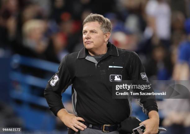 Home plate umpire Greg Gibson looks on during the Toronto Blue Jays MLB game against the Chicago White Sox at Rogers Centre on April 4, 2018 in...
