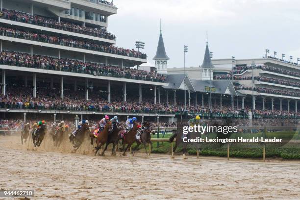 Palace Malice, with Mike Smith up, leads during the first turn of the 139th running of the Kentucky Derby at Churchill Downs in Louisville, Kentucky,...