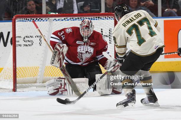 Zac Rinaldo of the London Knights is stopped on a break by Matt Hoyle of the Guelph Storm in a game on December 12, 2009 at the John Labatt Centre in...