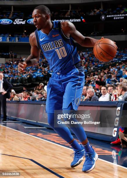 Dorian Finney-Smith of the Dallas Mavericks handles the ball during the game against the Phoenix Suns on April 10, 2018 at the American Airlines...