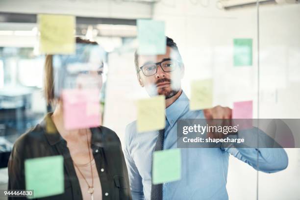 bringing the best ideas forward - brainstorming wall stock pictures, royalty-free photos & images