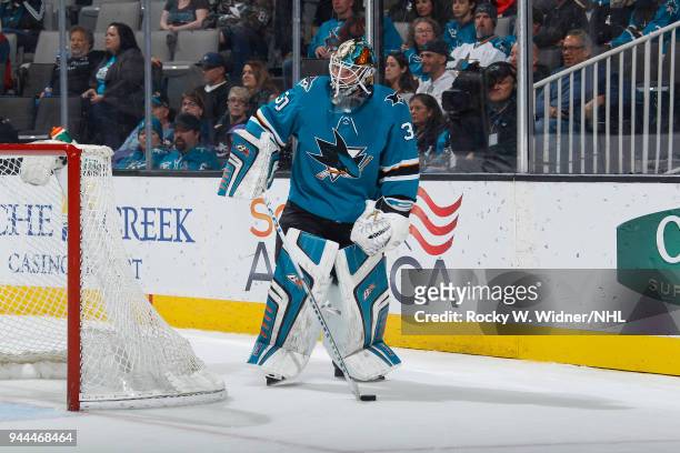 Aaron Dell of the San Jose Sharks controls the puck against the Minnesota Wild at SAP Center on April 7, 2018 in San Jose, California. Aaron Dell