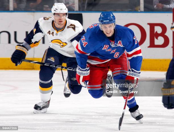 Ryan Callahan of the New York Rangers looks for the puck as he skates against Andrej Sekera of the Buffalo Sabres on December 12, 2009 at Madison...