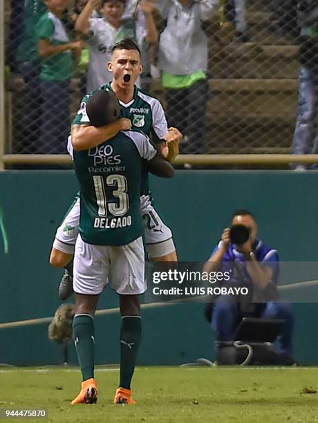 Colombia's Cali player Nicolas Benedetti celebrates with a teammate his goal against Uruguay's Danubio during their Copa Sudamericana football match...