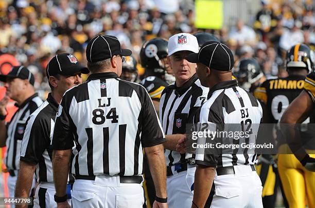 National Football League officials, including referee Terry McAulay, back judge Greg Steed, line judge Mark Steinkerchner and head lineman Tony...